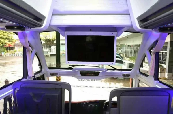 sewa bus Depok dengan fasilitas karaoke dan WiFi
