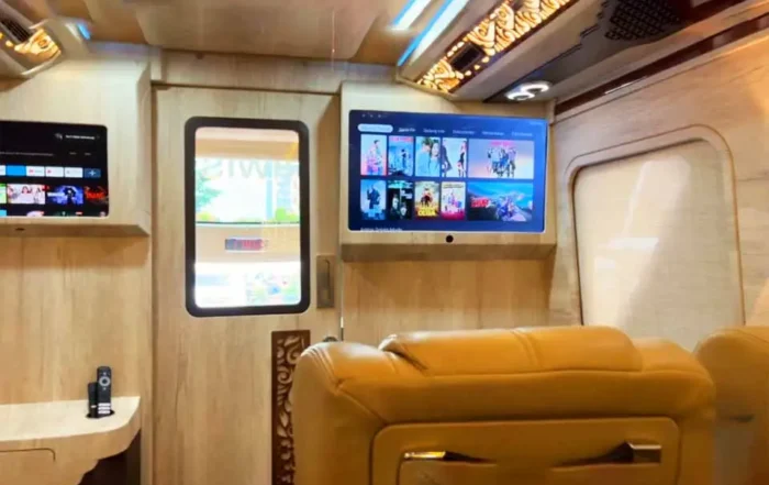 sewa bus pariwisata di Tangerang kursi 2-1 fasilitas karaoke